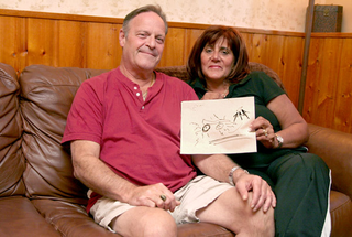The Andersons show off the now-legendary drawing.